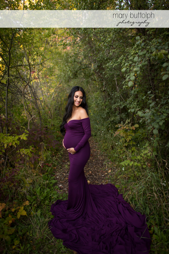 Woman enjoying her pregnancy in the woods at Skaneateles Maternity Photography