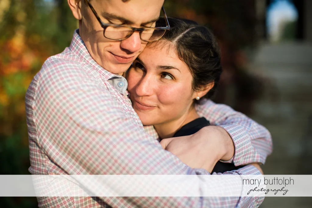 Couple in tight embrace at Cornell University Engagement