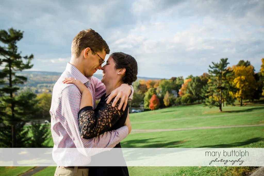 Couple rub noses at Cornell University Engagement