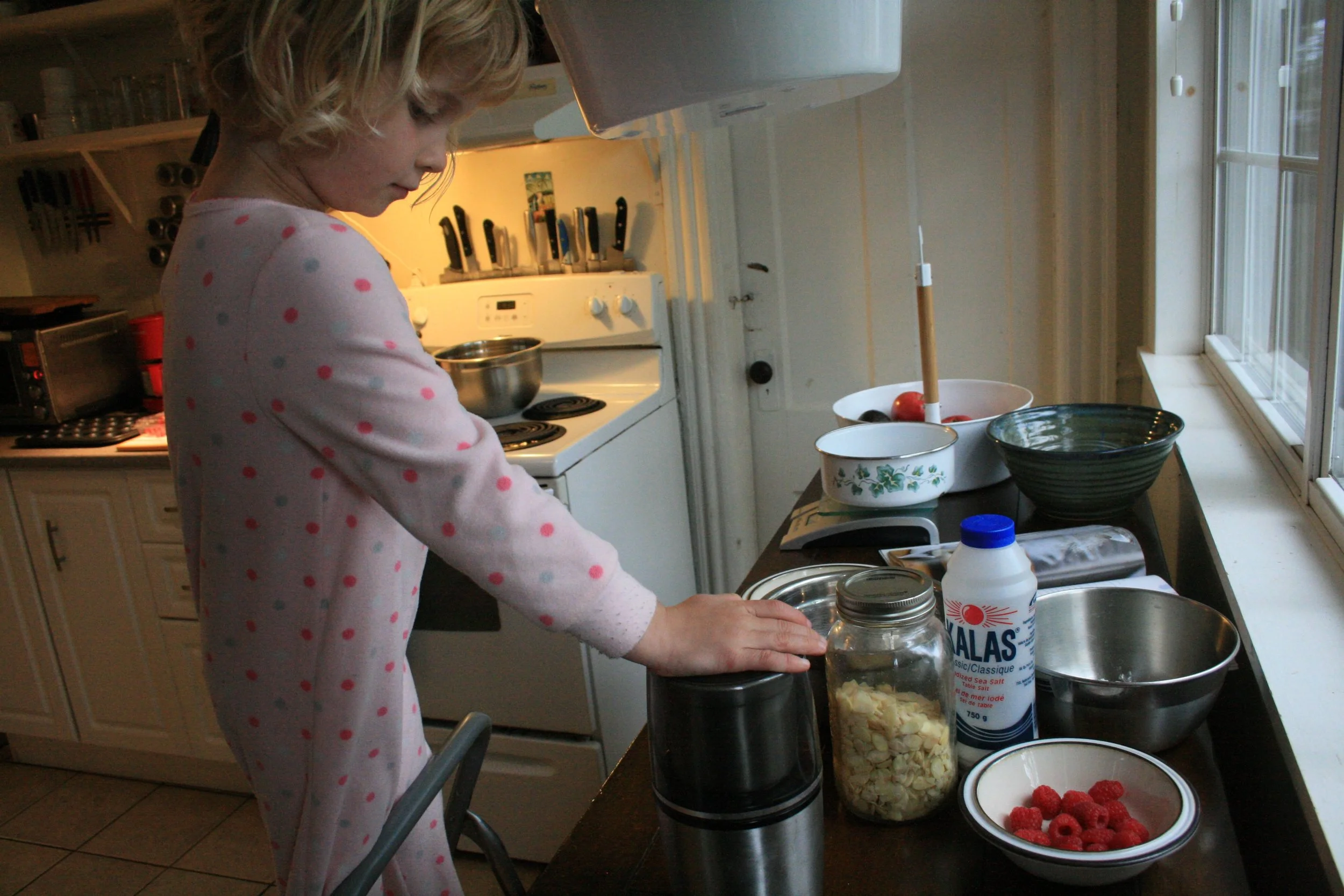 grinding up sliced almonds to make almond flour