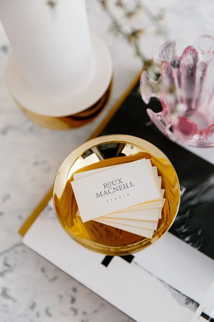 Stacked business cards with Roux MacNeill Studio