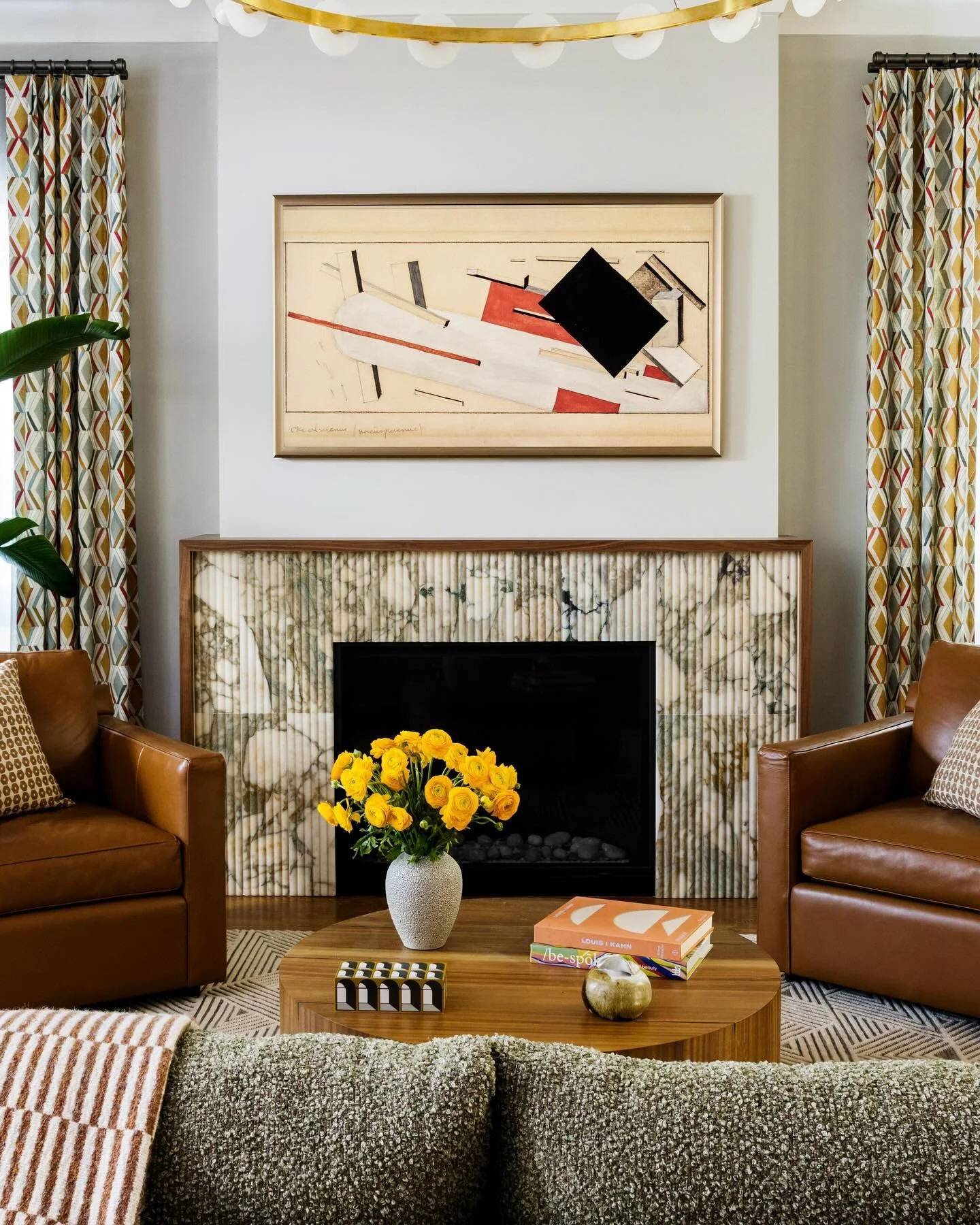 A closer look at one of our favorite moments from Mid-Century Modern, Reimagined: the Calacatta green tile fireplace anchoring the living room. Head to our latest reel to hear Rob share the story behind the design!

Photographer: @annarouth 
Tile: @c