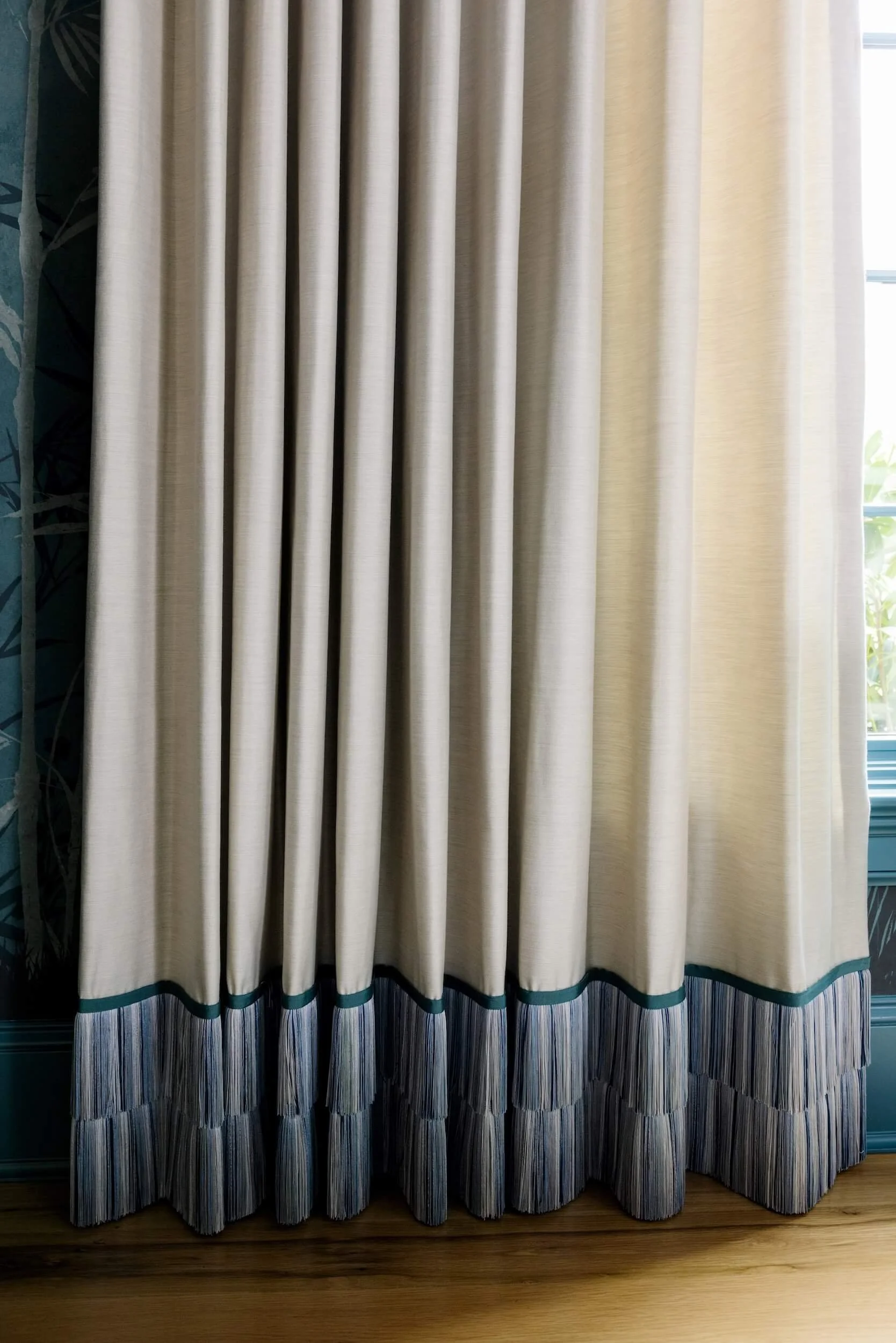 Custom cream curtains with a ruffle at the hem