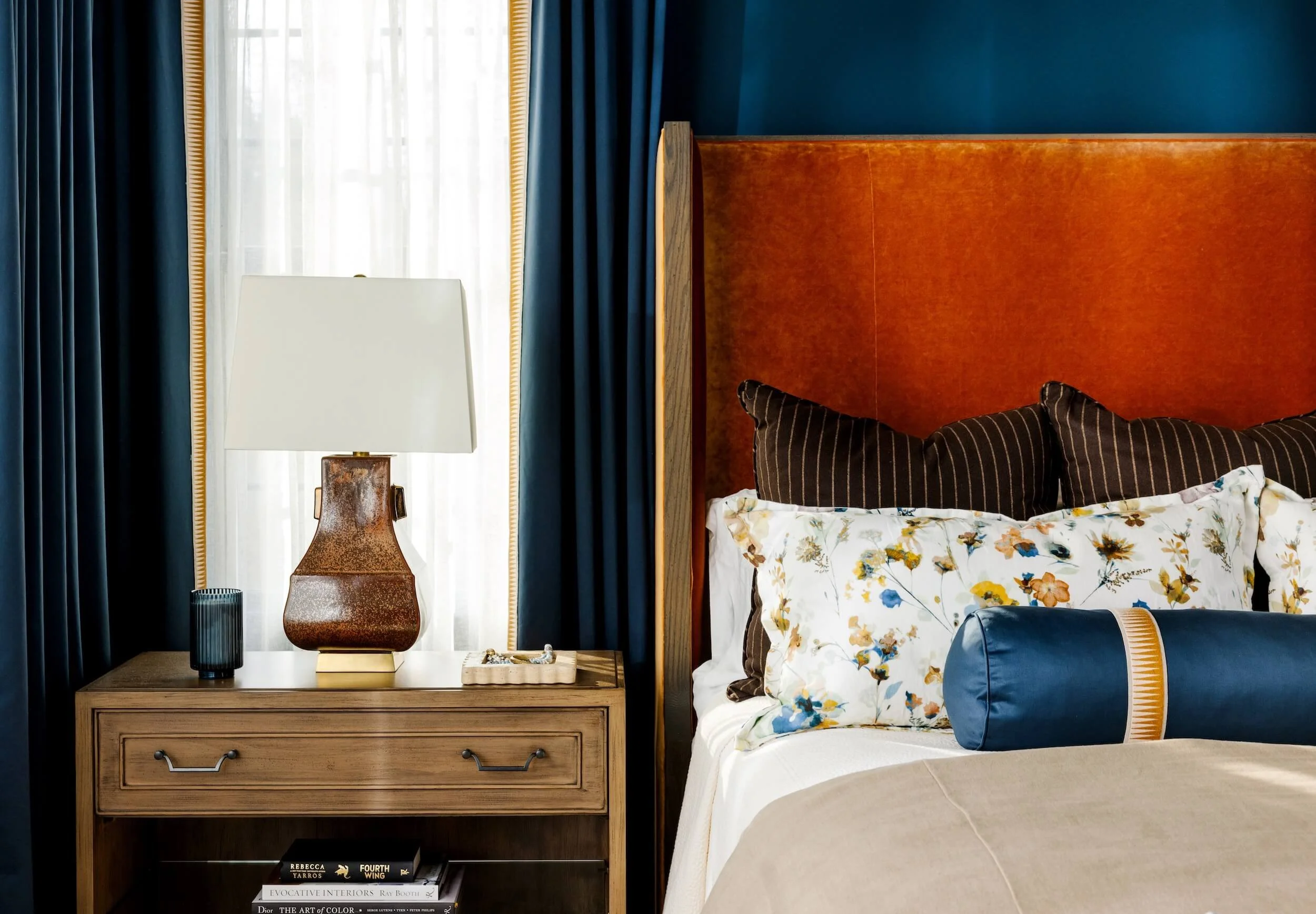 A view of the side table and custom designed bed