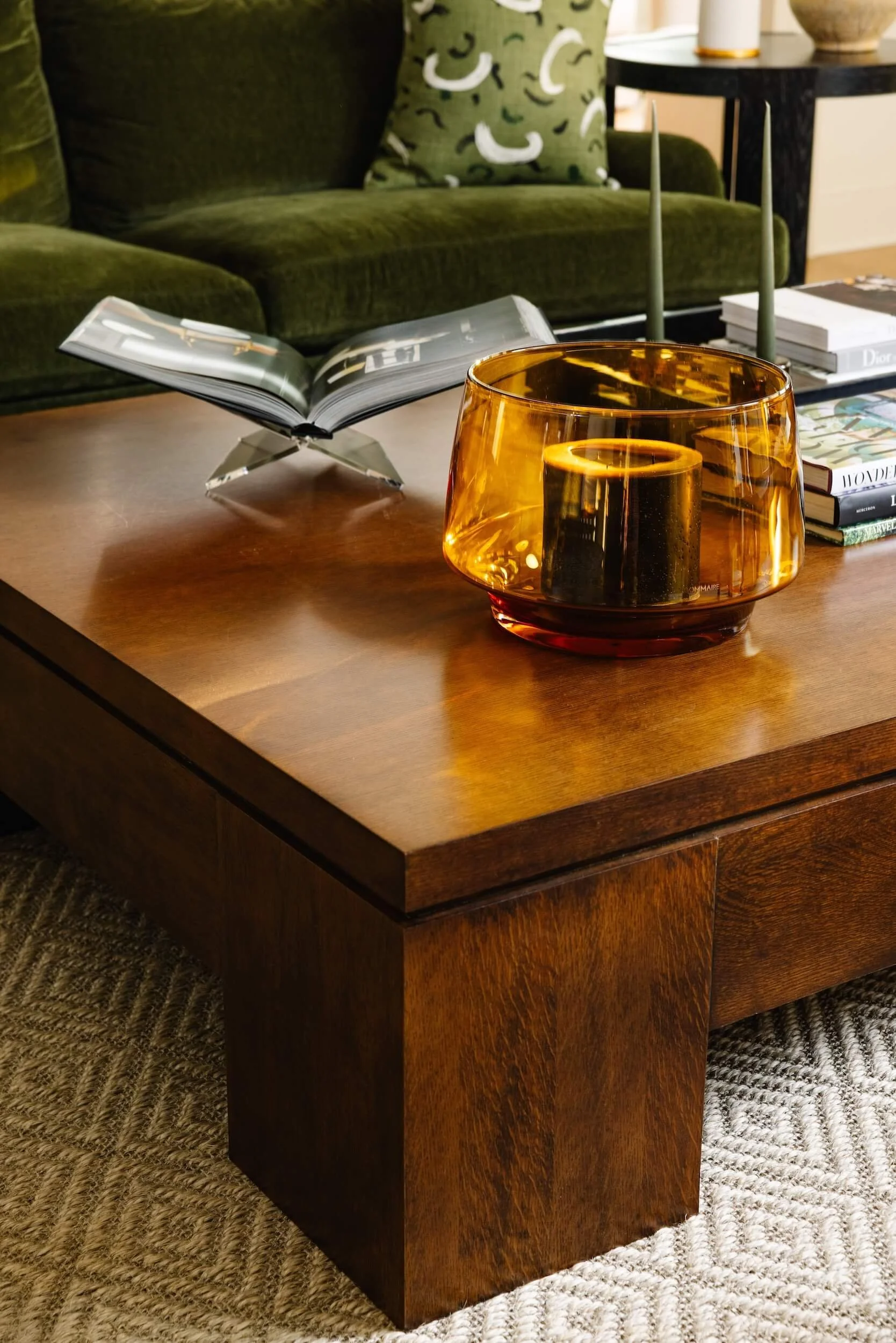 A close up at the wooden coffee table and decorative accents