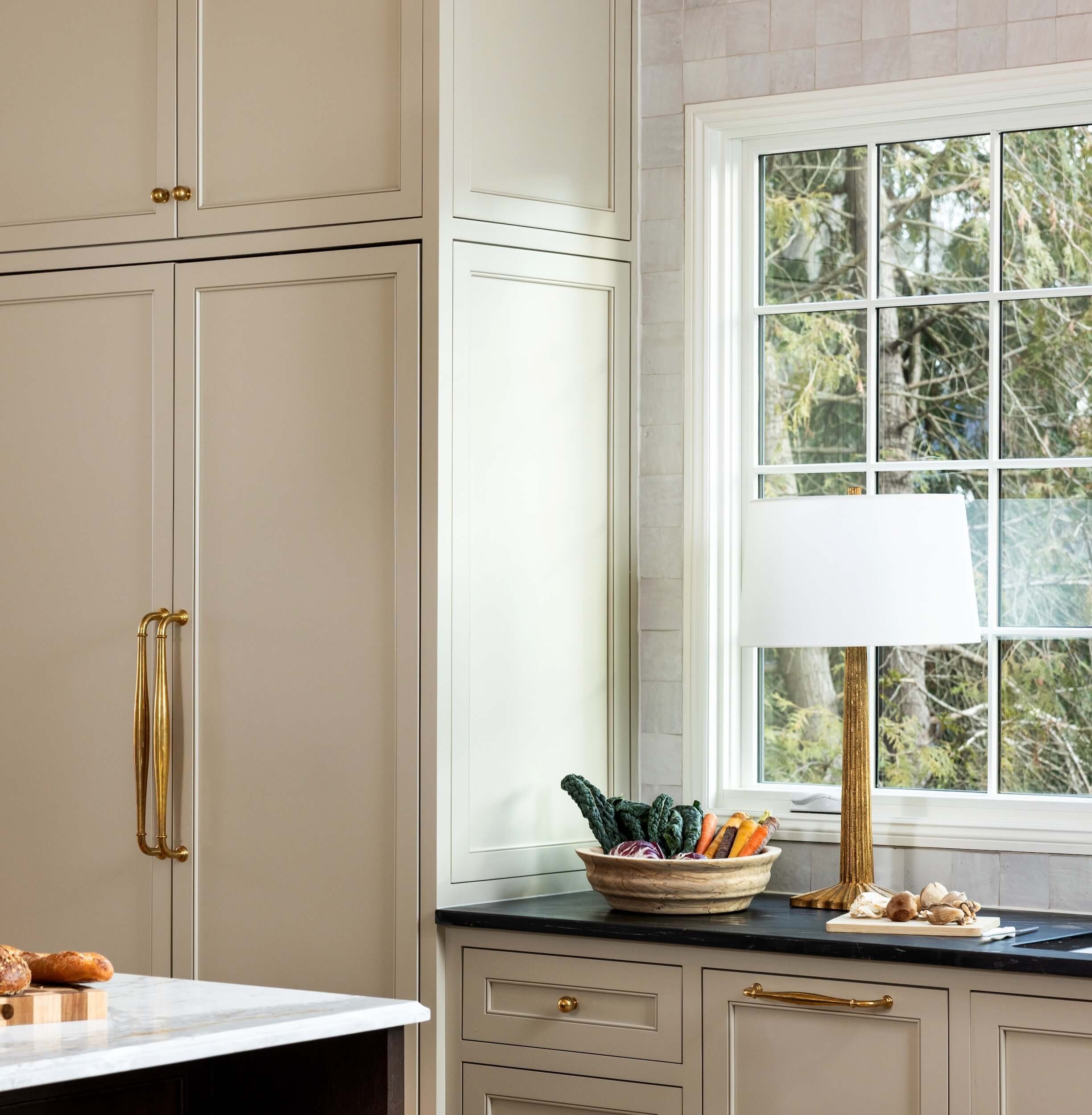 A detailed view of the kitchen cabinets and panel ready fridge