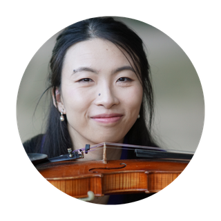 A young women headshot with violin horizontally below her head