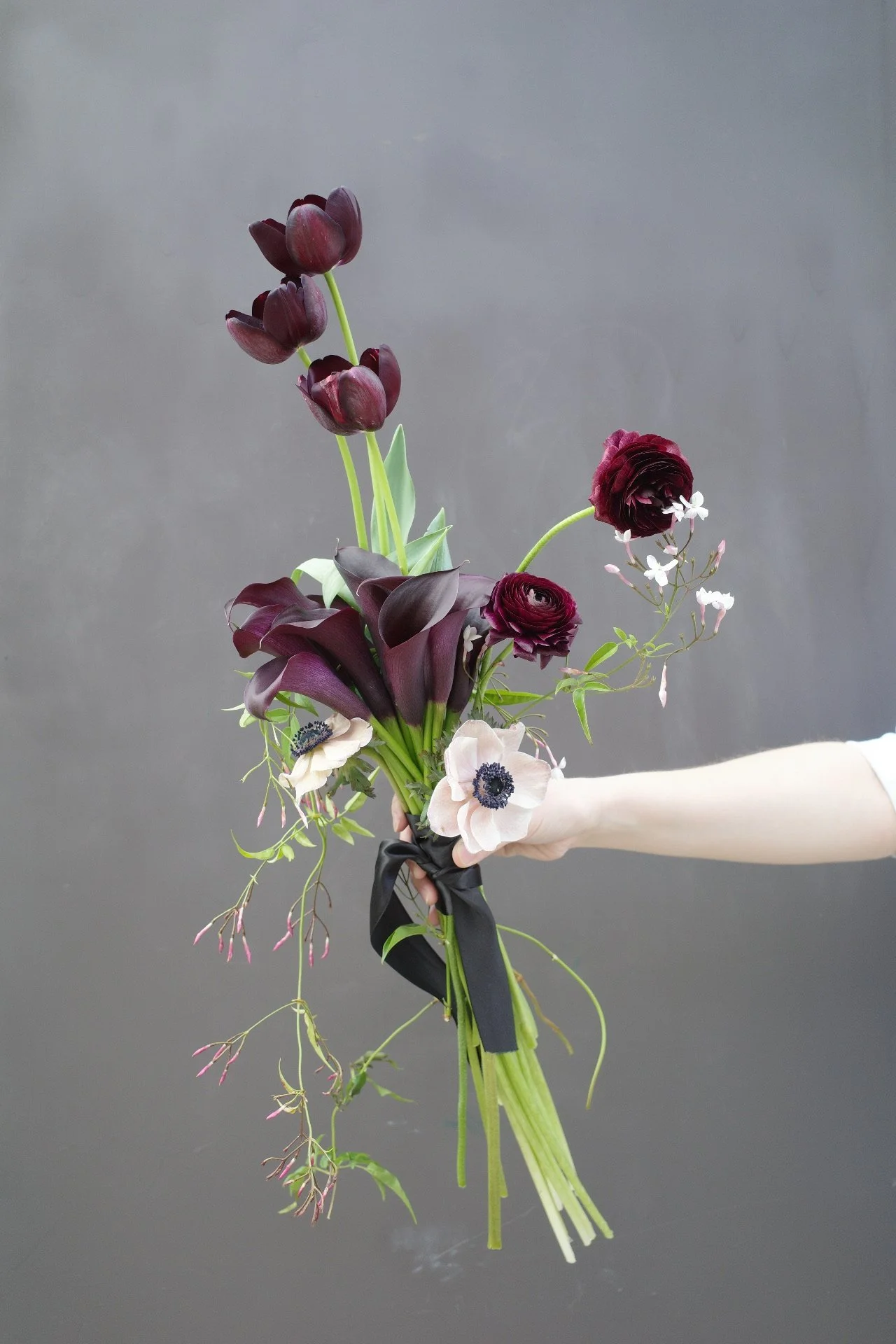 ranunculus, anemone, calla lily & jasmine bouquet