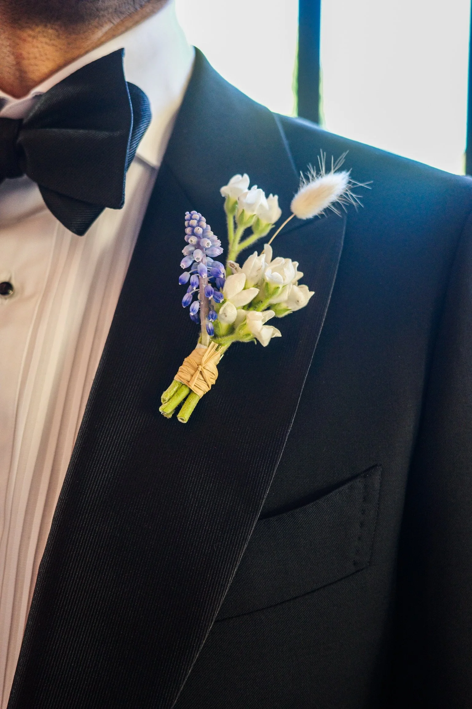 muscari, tweedia and bunny tail boutonniere 
