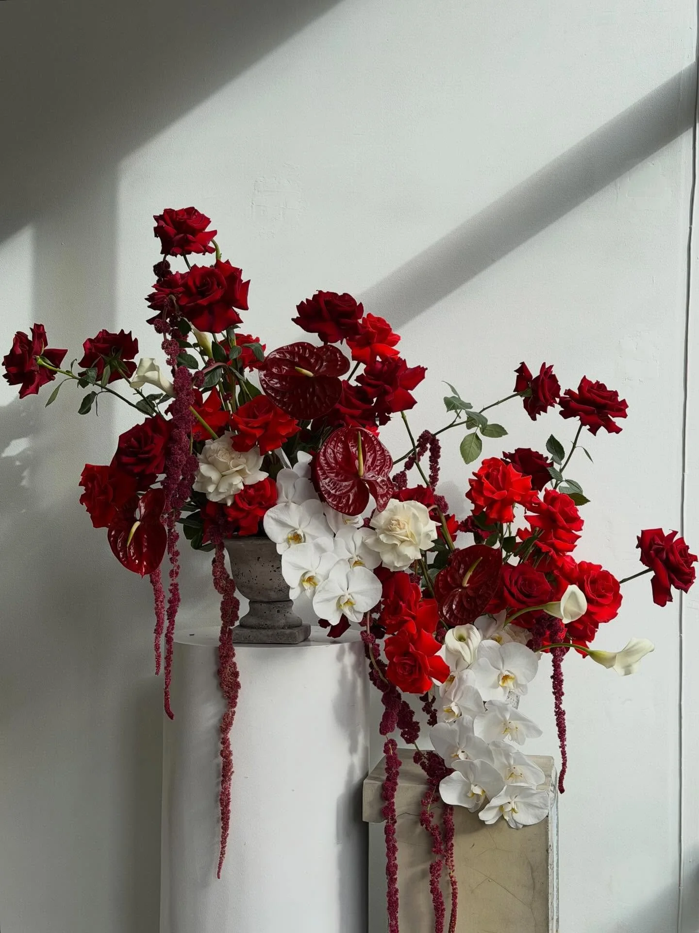 a mix of white and deep red &mdash; a subtle reference to white and red wine, and the perfect palette for this engagement party. loved bringing this one to life
