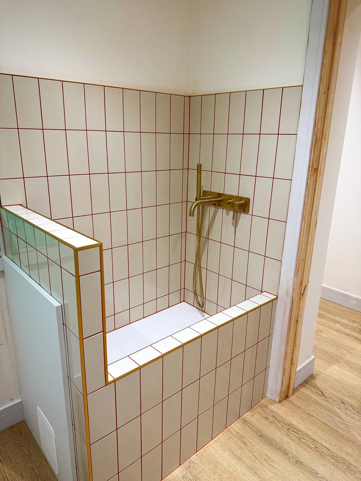 Woof! 🐶. A Dog shower we  completed before Christmas. Remaining utility walls will be finished in the new year once the work tops are installed. Cream tiles, gold trims finished with a burgundy grout and silicone. #dogshower #tiling #tilers #dogwash