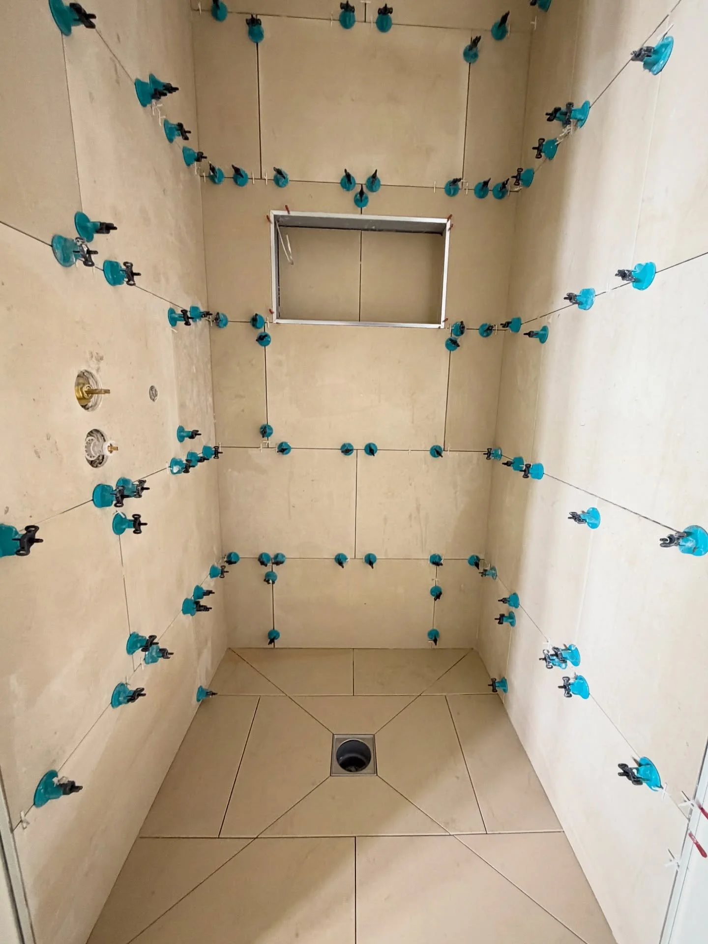 Kicking off 2026 with 100m2 of limestone across 3 bathrooms and a ground floor area in Staffordshire. Why is it always freezing 🥶 when the wet cutter comes out! Never on those red hot summer days! #tilers #tile #limestone #naturalstone #nottinghamti