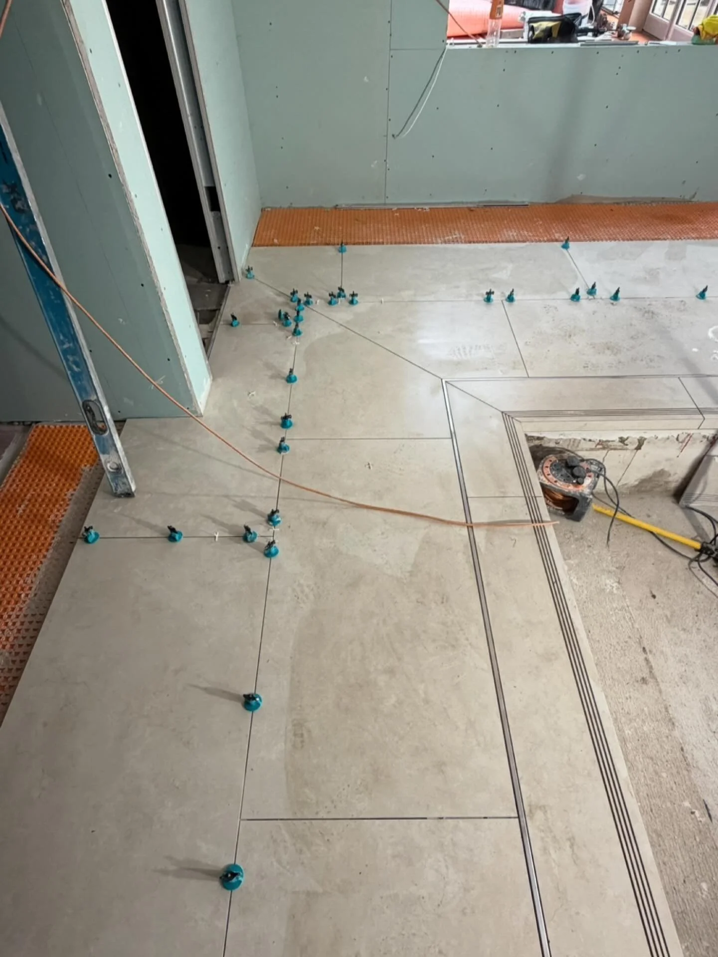 Pool details taking shape&hellip; 1200x600 @lussostone tiles turning around the corner of the pool to keep the long length  adjacent to the pool edge. @studiotwentyinteriors #tiling #tiles #pooltiles #swimming_pool #nottinghamtiler