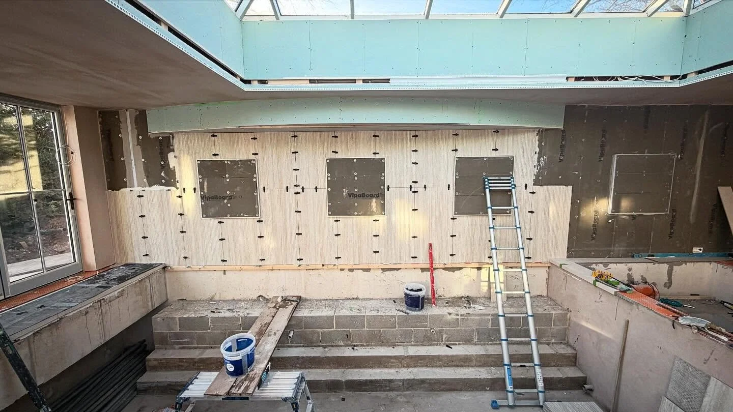 Feature wall tiling in progress. We have 4 floating boxes which have led lights surrounding them, to backlight the feature tile which will sit on the front of the floating boxes. 4 1mx1m metallic tiles will go onto these which will really make this r