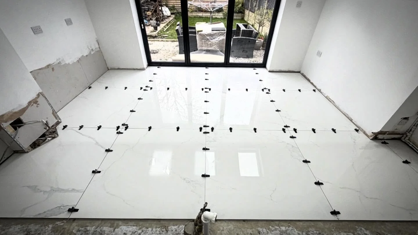 1200x1200 tiles going down for this customers new kitchen 💪🏼💪🏼. #tiler #tiling #tiles #bigboys #bigtiles