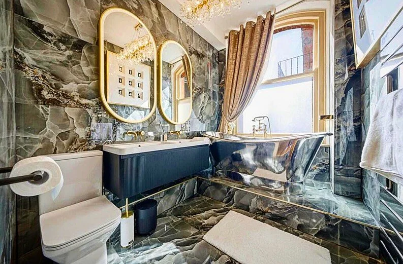A bath to make a statement! Some finished photos from a job completed in central Nottingham earlier this year. A metallic bath really does make a bathroom pop! #tiler #tiling #tiles #metalic