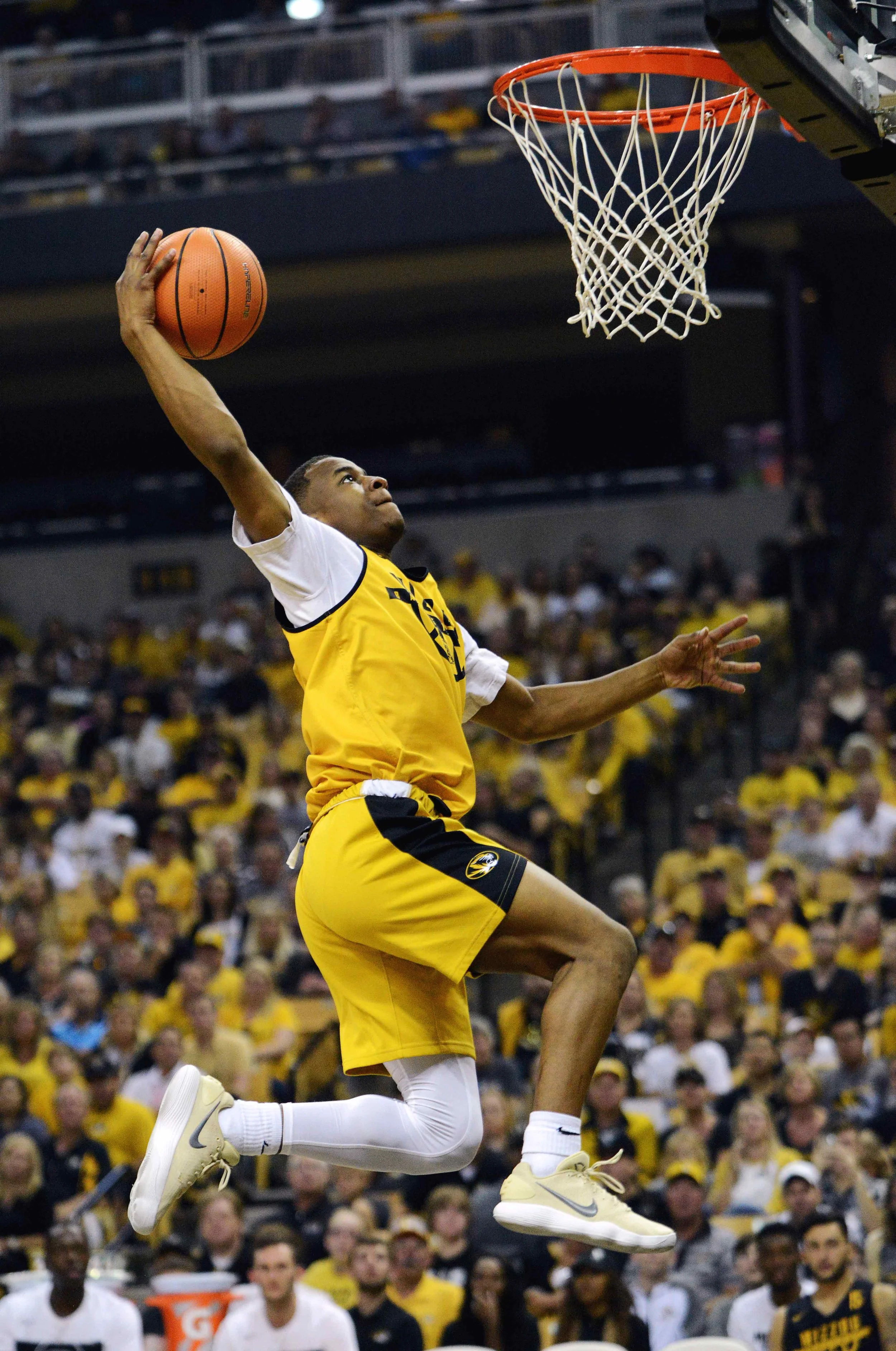 MU freshman C.J. Roberts goes to dunk the ball in the Mizzou Madness men's basketball scrimmage after the Homecoming football game on Saturday Oct. 21, 2017 at Mizzou Arena. The Black team won against the Gold team in the scrimmage, 32-19.