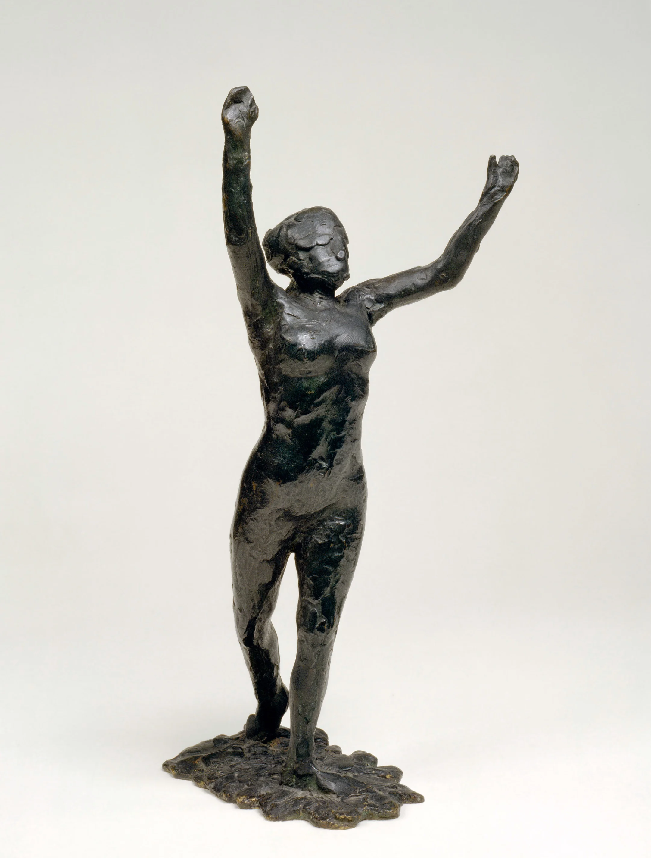 “Dancer Moving Forward, Arms Raised “