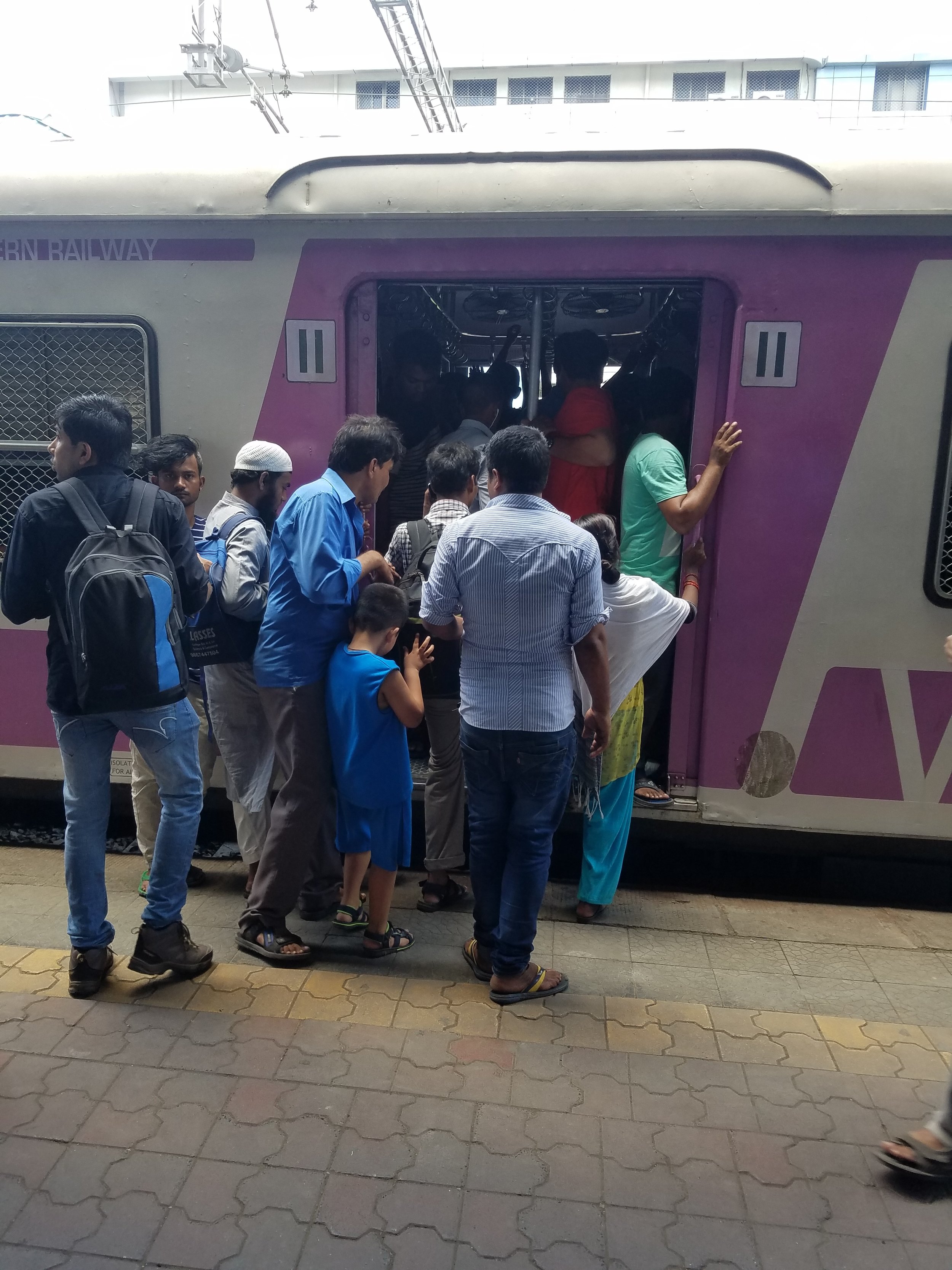 The trains come every 3 minutes, but there are so many people, that they push and pull very hard to get on. 