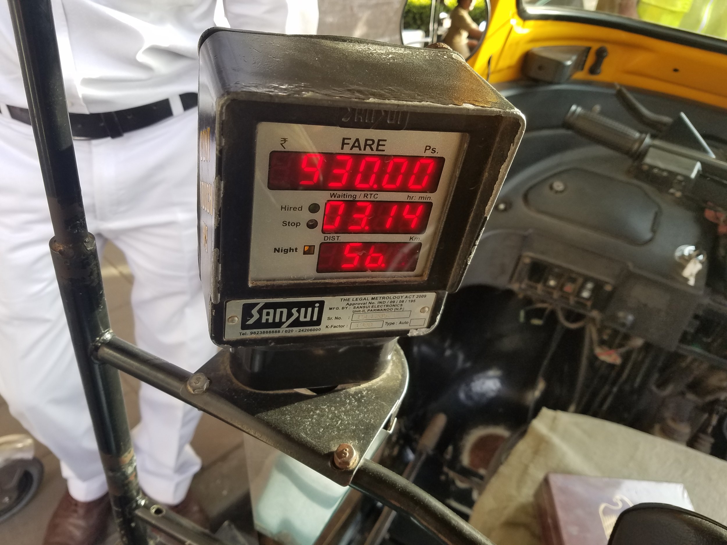I've watched the meter run up slowly as he kept it on since he picked me up from the mango stand. After 6.5 hours, I owe him 930 Rs / $15. I visited the ATM once more before heading out so I could give it to him. I hand him all the cash I have left,