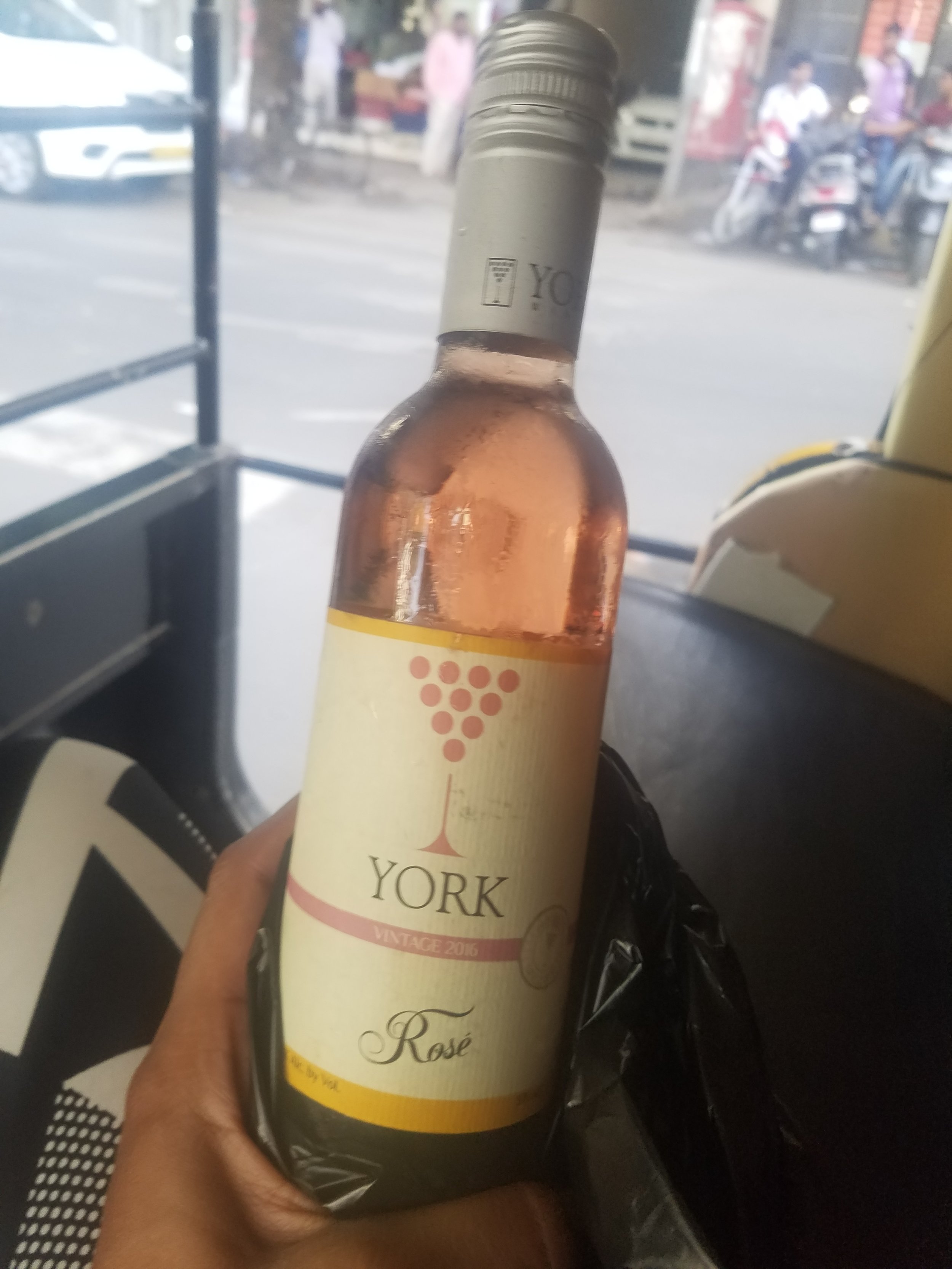 We have a few hours to go, so I ask if there's a bar where we can catch some of the game and I can have a sippy sip. He drives for a minute and doesn't believe anything open is close enough. Except the wine store! He stops on the side of the road an