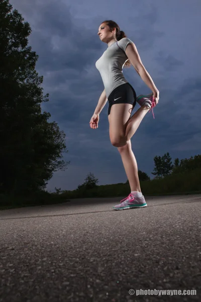 woman-stretching-outdoor-dramatic-background
