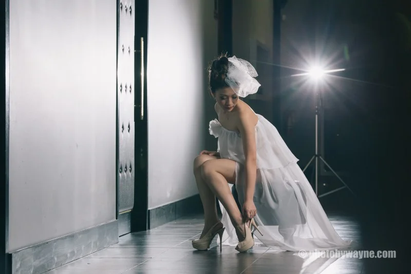 bride fixing her heels