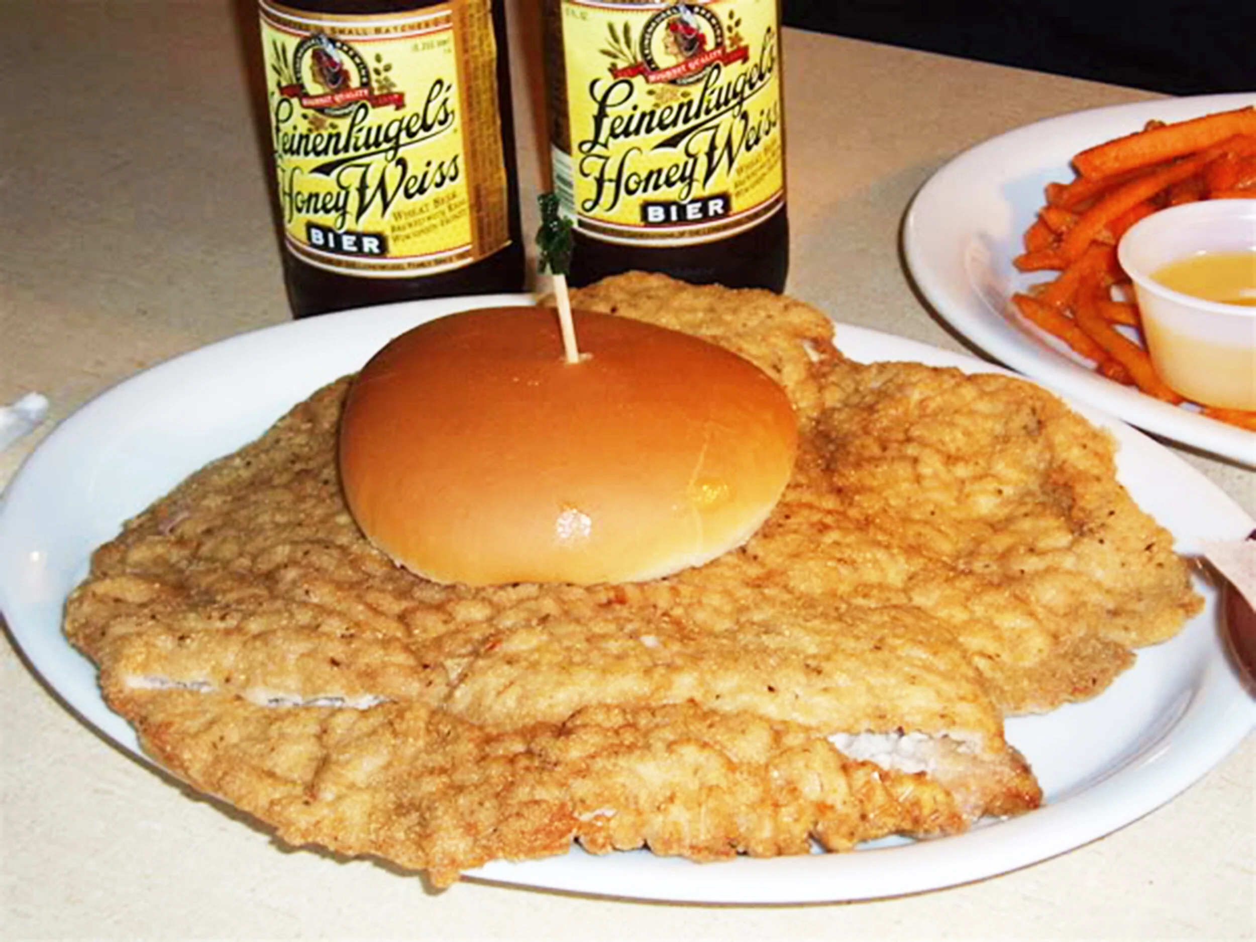“The World’s Largest Tenderloin” from R. St. Olaf Tap in St. Olaf, Iowa. Source: “World’s largest tenderloin, giant Gunderburger and ethnic cuisine, all along one Iowa route,” Homegrown Iowan, August 2017.