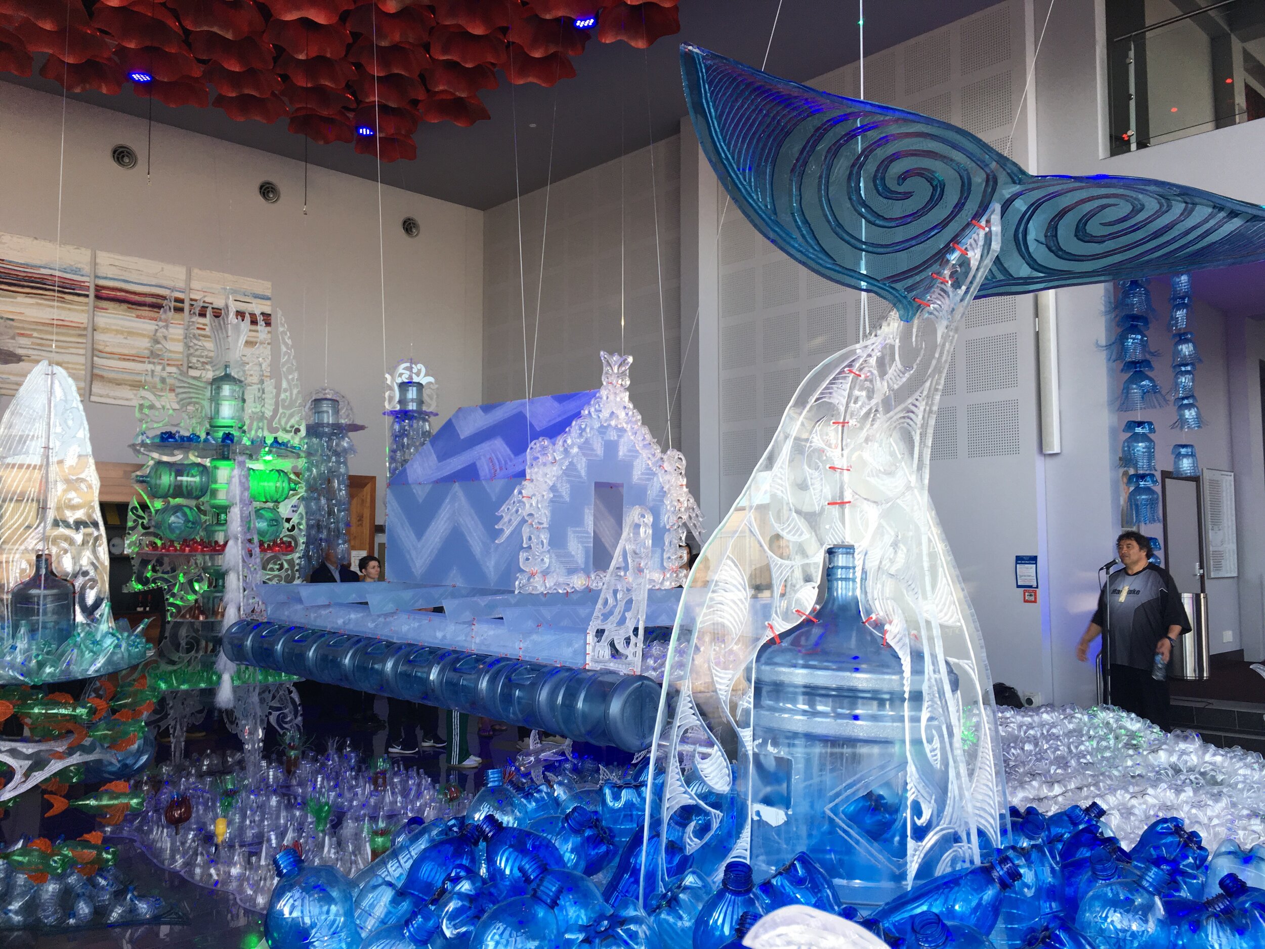 A speaker blesses George Nuku’s installation, made from recycled plastic, at Gisborne’s War Memorial theatre.