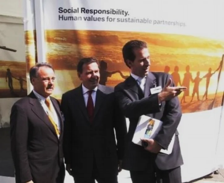 Gerhard Fritz Schroder Chancellor of Germany and Guido Prick CEO of eCO2value, and Global Oil and Gas Board Member, being commended for outstanding environmental  work with BMW and his commitment to excelence.