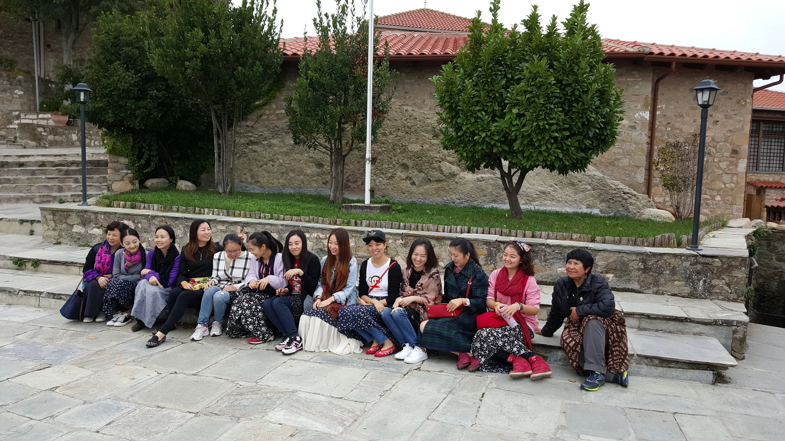 Global Oil and Gas Board Member Marta U Yoshimura with a group of young women entrepreneurs from The People's Republic of China. At top of The Monastery of Great Meteoron, Thessaly, Greece. 