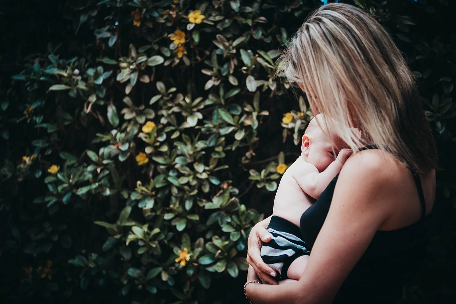 mother holding baby son