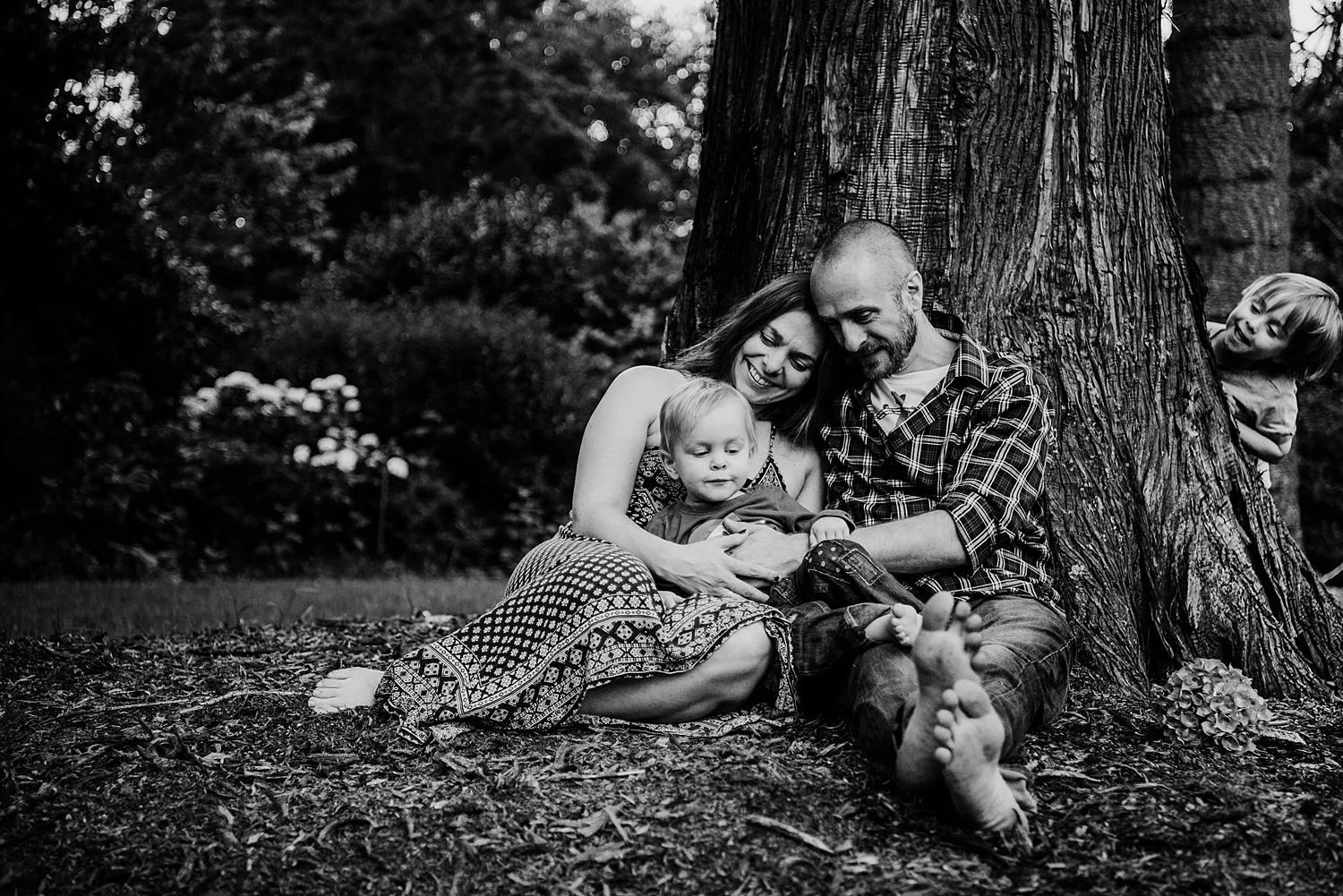 family seated under tree