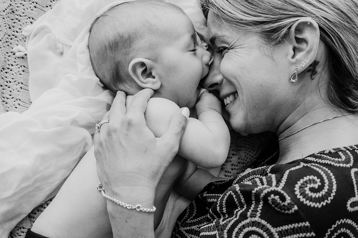baby sucking mothers nose