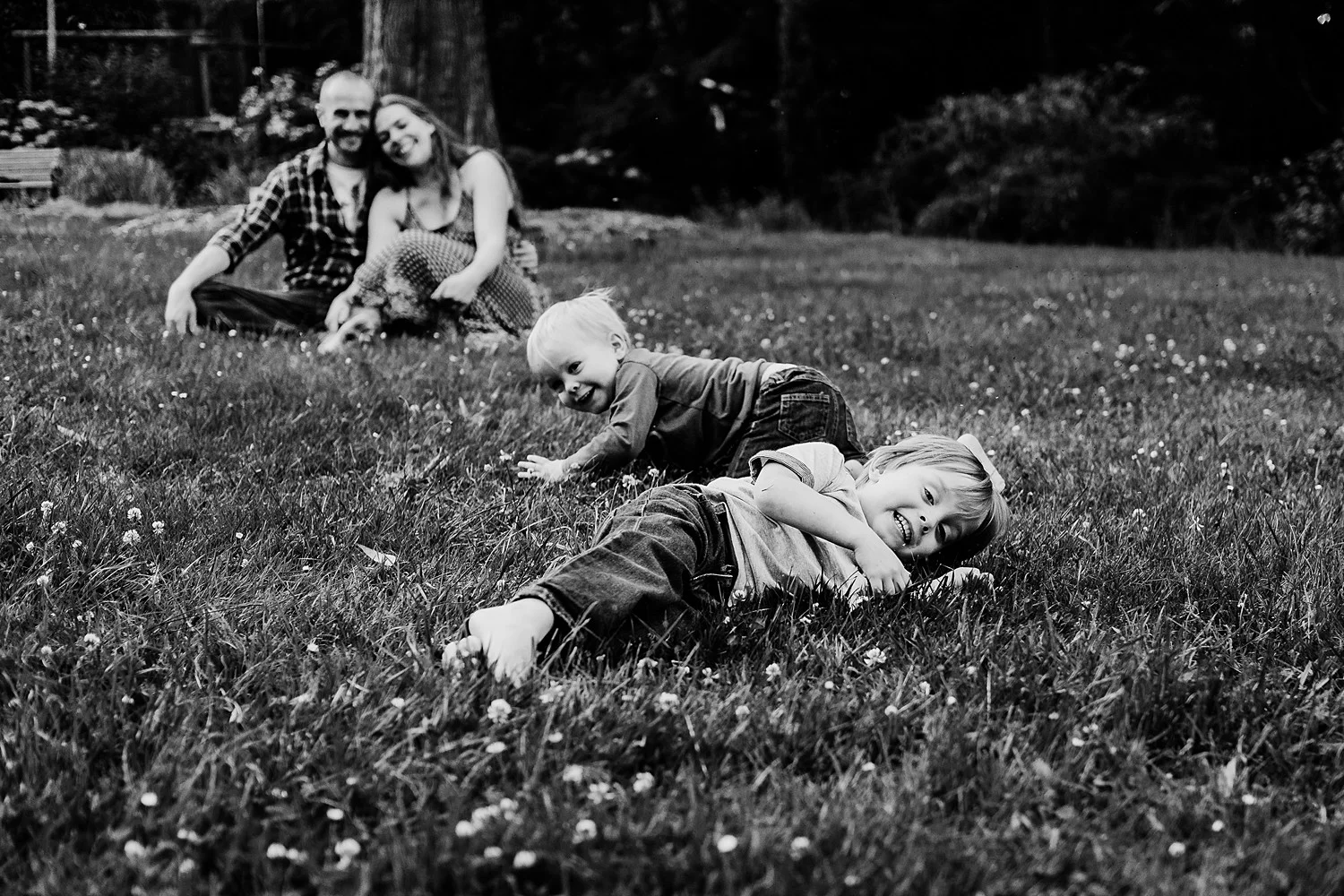 little boys rolling down hill