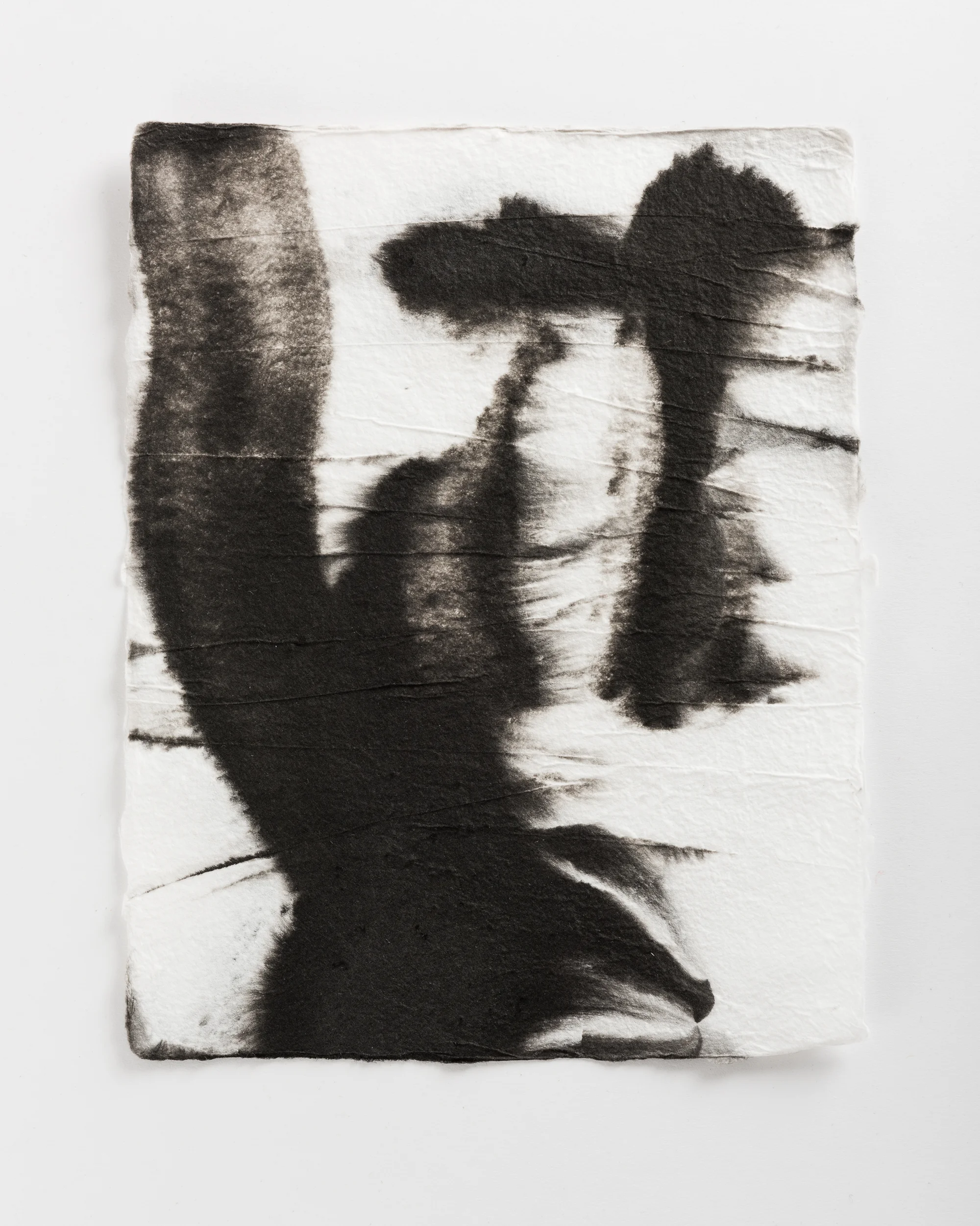 Handmade paper. Made by hydrating and beating cotton linter, and then forming 8x10 sheets onto a vacuum table and adding black pigment directly to the wet sheets.