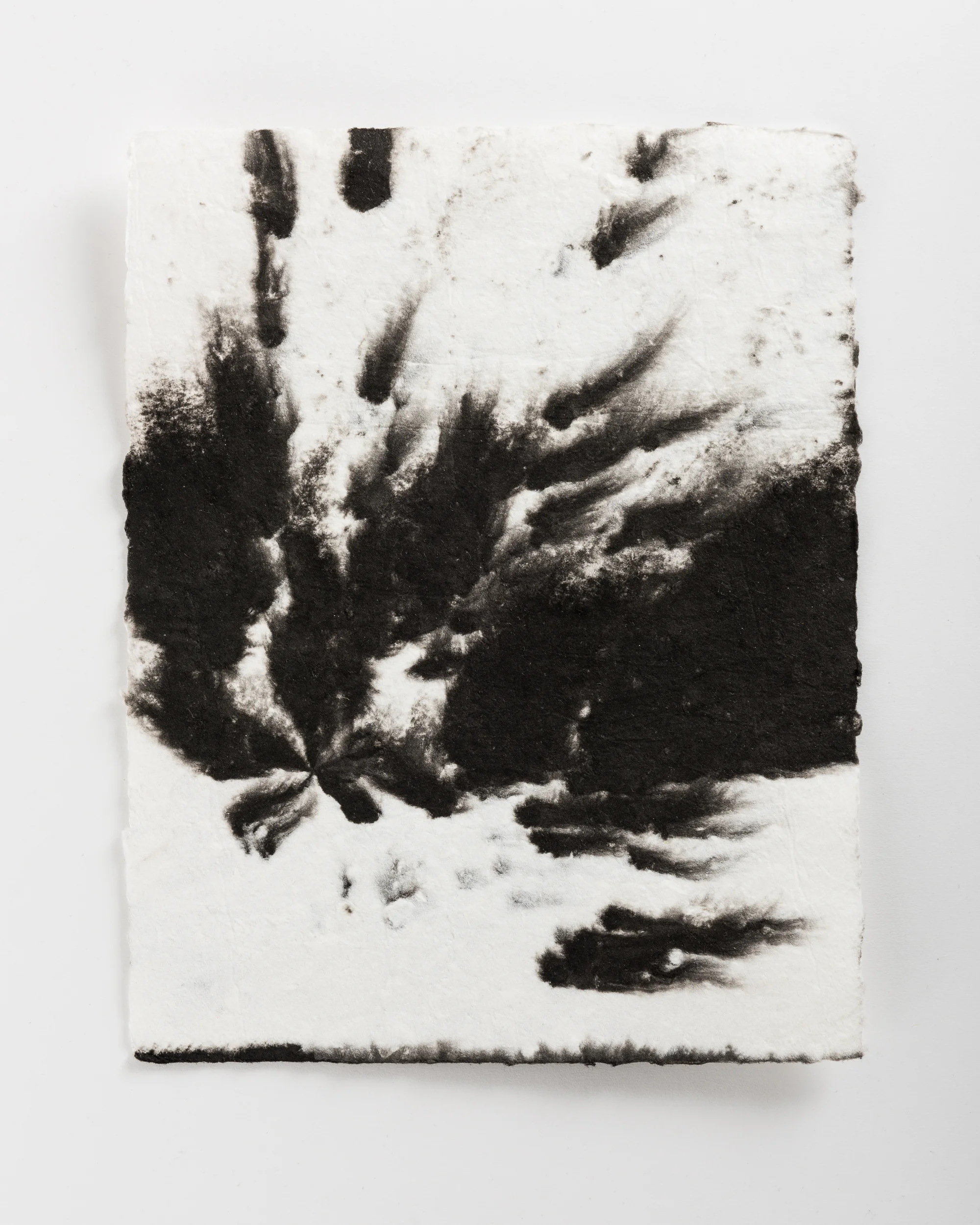 Handmade paper. Made by hydrating and beating cotton linter, and then forming 8x10 sheets onto a vacuum table and adding black pigment directly to the wet sheets.