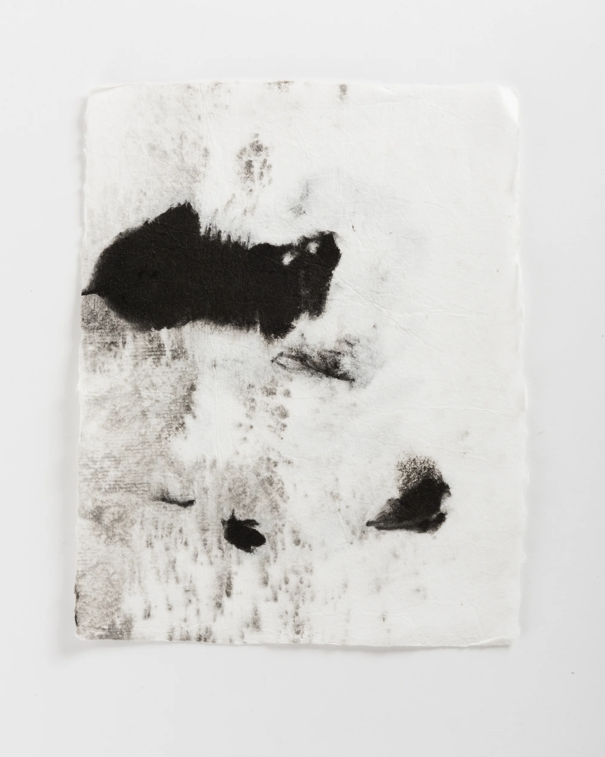Handmade paper. Made by hydrating and beating cotton linter, and then forming 8x10 sheets onto a vacuum table and adding black pigment directly to the wet sheets.