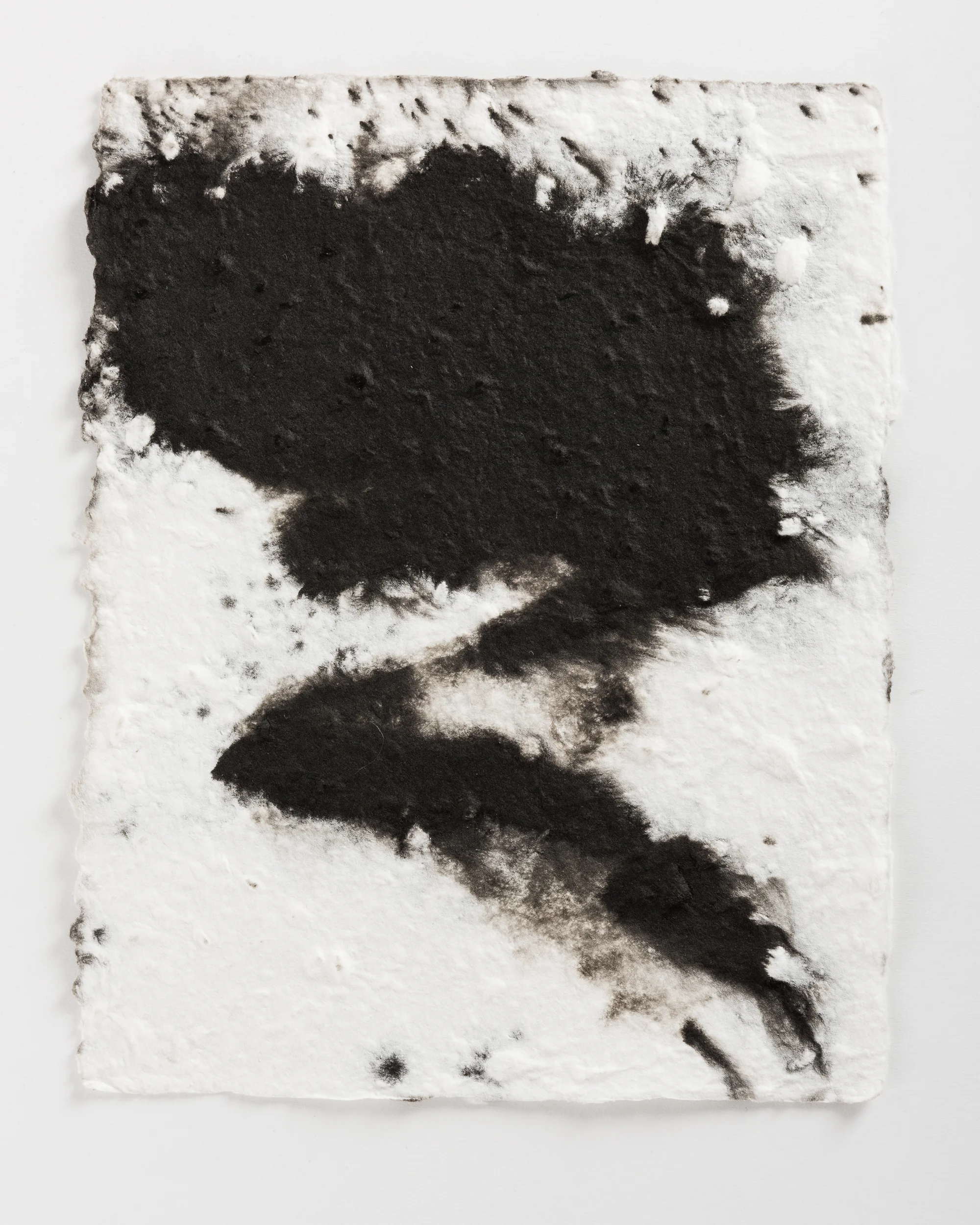 Handmade paper. Made by hydrating and beating cotton linter, and then forming 8x10 sheets onto a vacuum table and adding black pigment directly to the wet sheets.