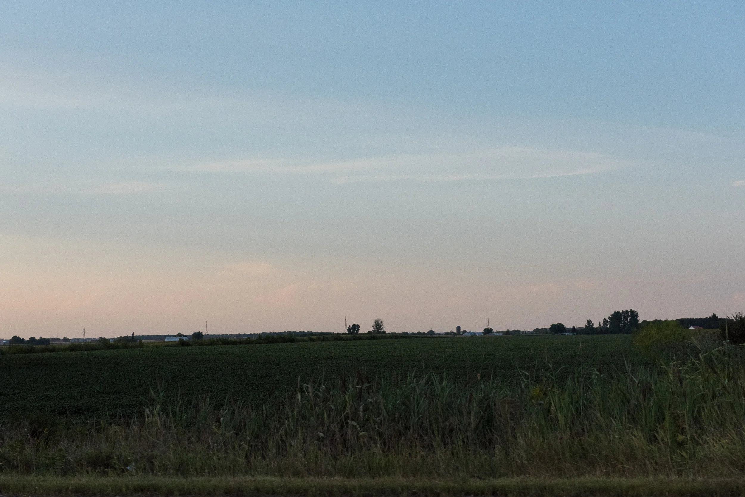 Small series of images taken from the passenger seat window while driving down the highway at 100km/h. The foreground is blurred even at 1/3200 of a second, but the background remains in focus, giving it a painterly effect.
