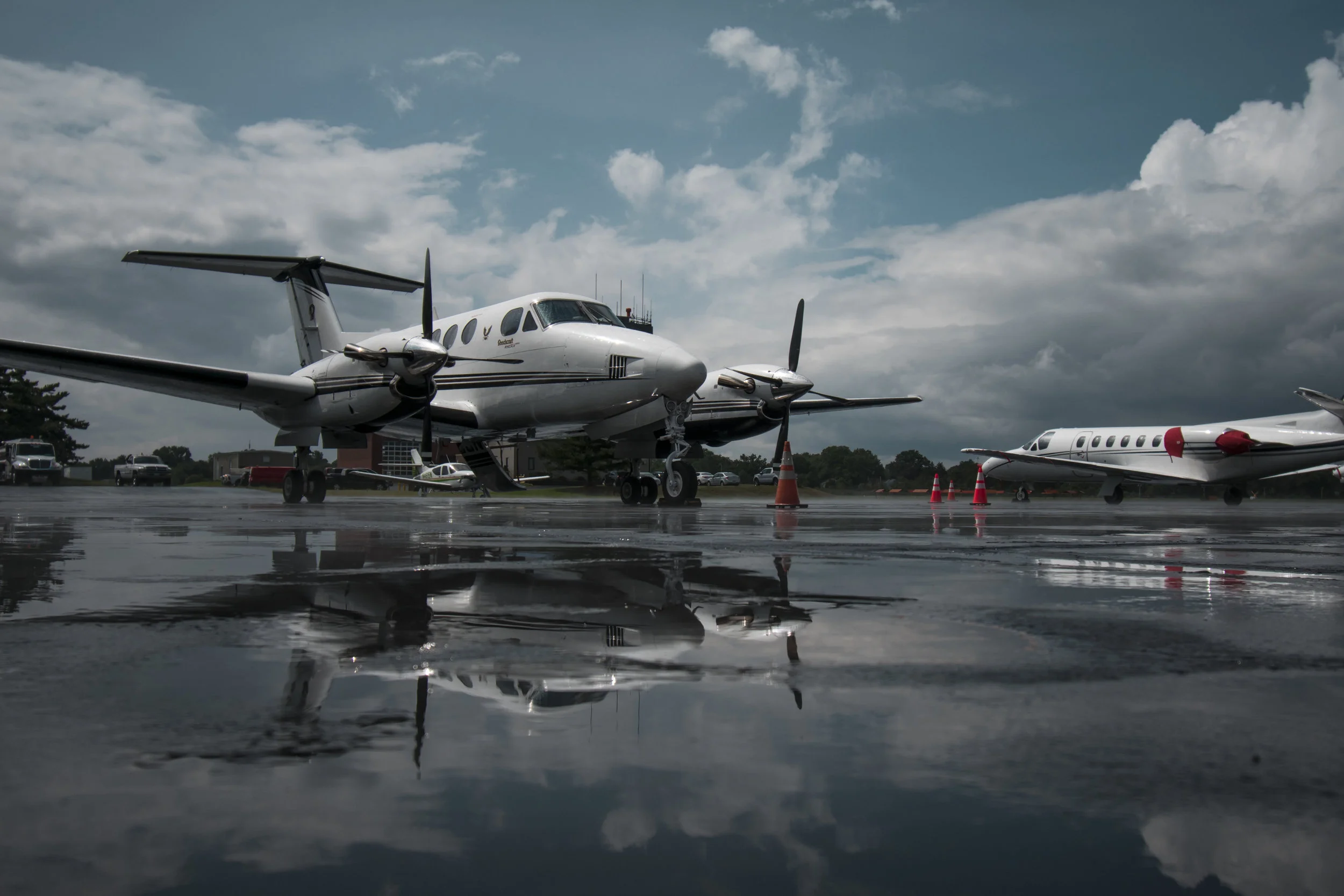 king air on ramp with reflection in puddle.jpg