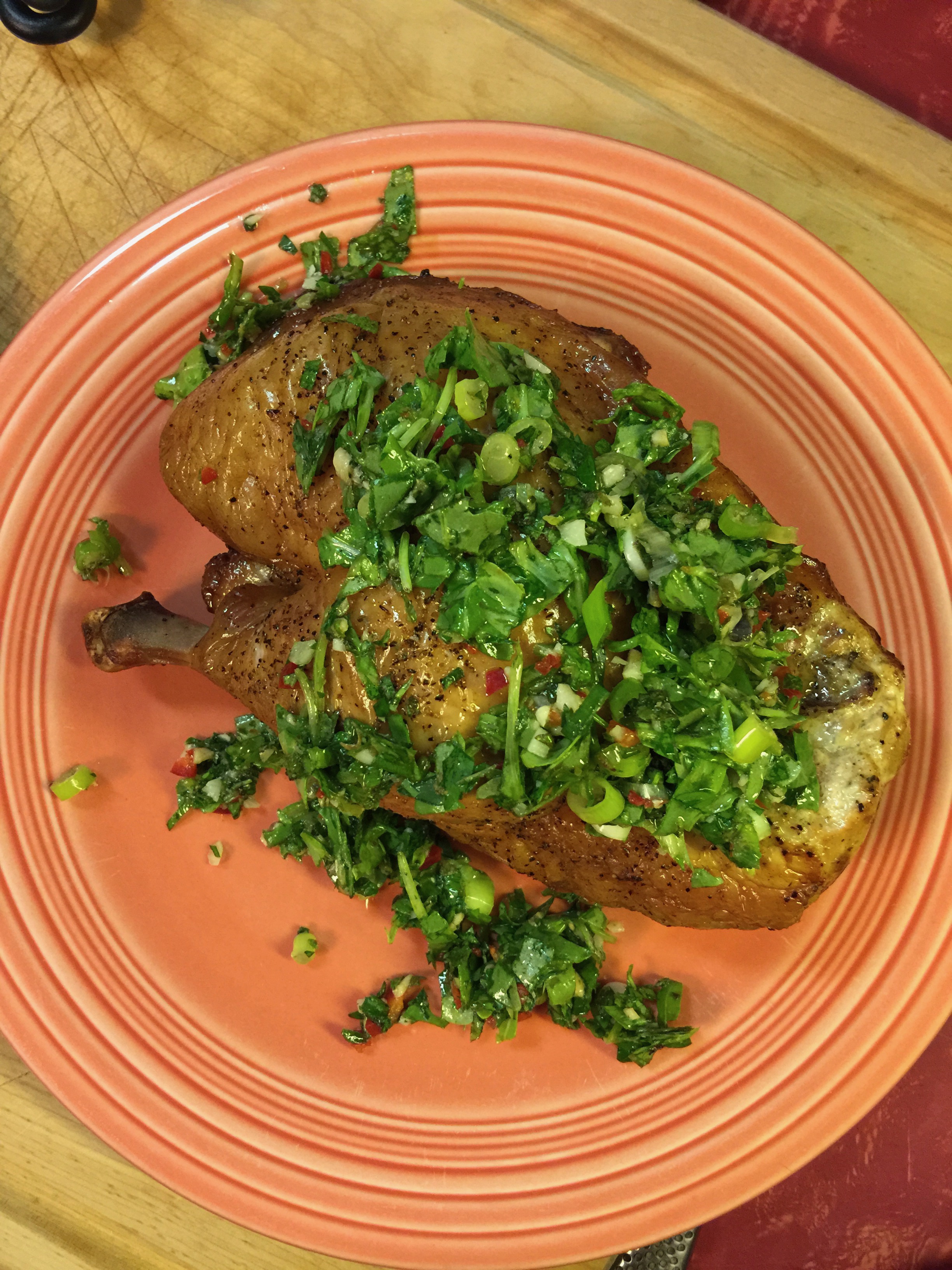 The plated version. Although the entire half never gets consumed in one sitting and the skin gets discarded, we like to put the salsa verde right on top of the roasted half.