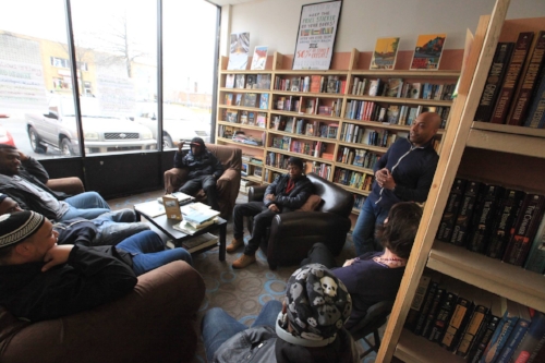 Pablo Sierra, owner of Walls of Books D.C., leads a discussion.