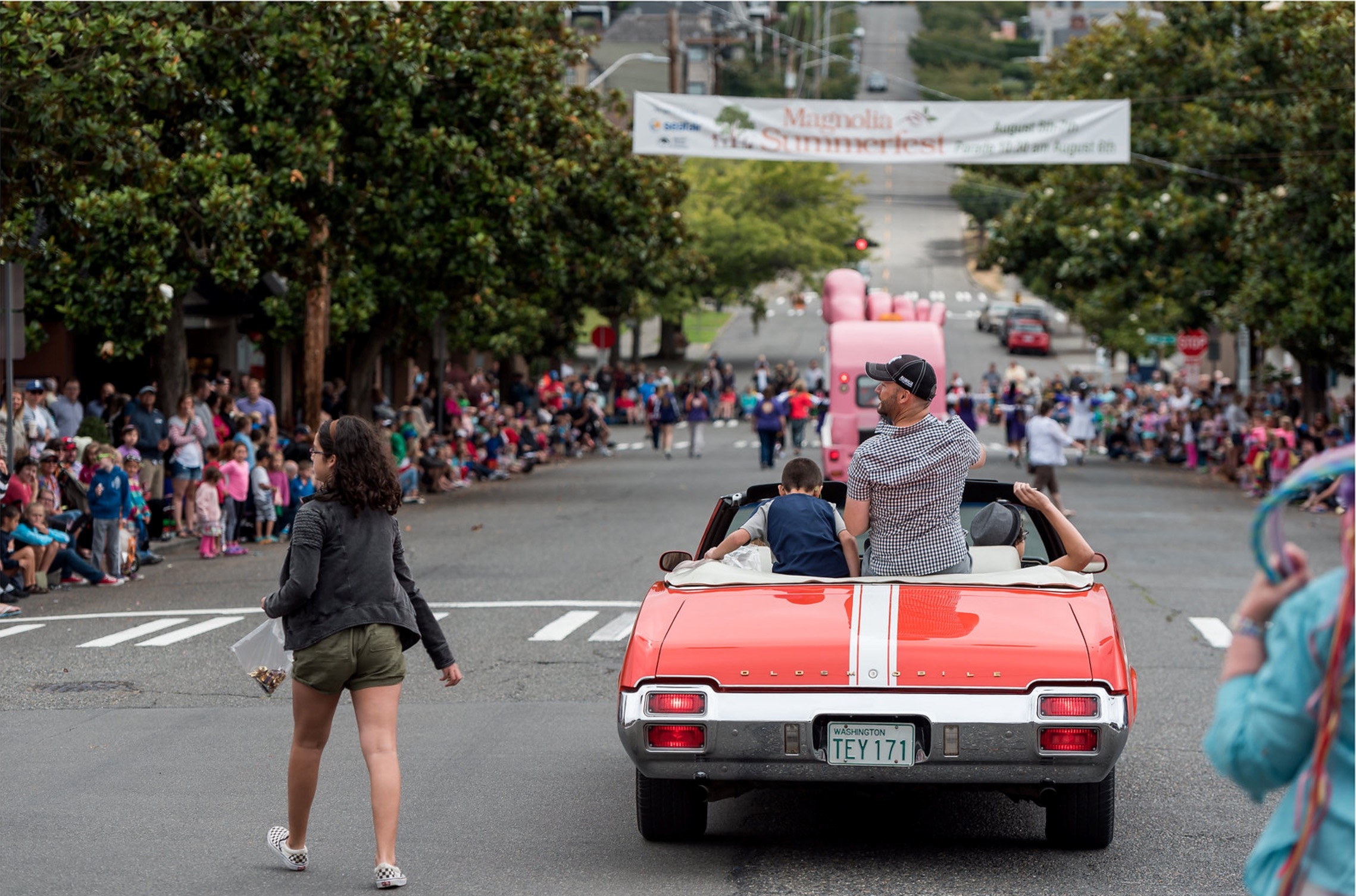 Magnolia Summerfest parade with spectators along a Seattle neighborhood street