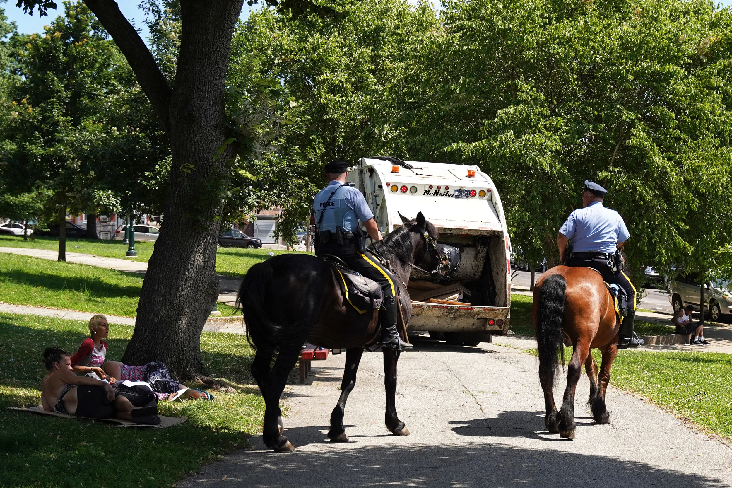 Philadelphia Mounted police officers patrol McPherson Square Park located at intersection of E. Indiana Street and Kensington Ave. in Philadelphia, Thursday, June 27, 2019. According to couple at left, police allegedly move suspected drug users out 