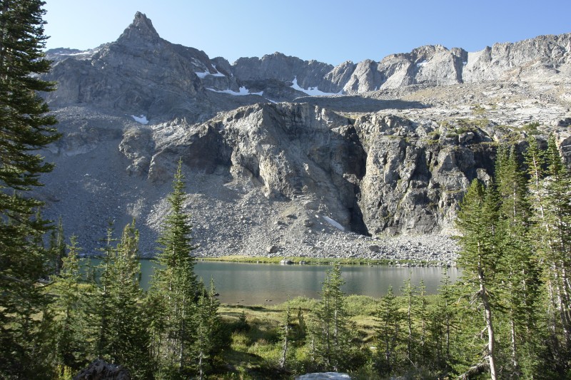 This is the first view you see of the lake. There is a waterfall that comes down the cliff on the opposite side of the lake, and another waterfall where the inlet to the lake cascades down from the basin above.