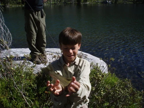 In one of those lakes Jim caught a very large trout, and I almost got there in time to get a picture of it. Judging by the size of its tail, that sucker was huge!
