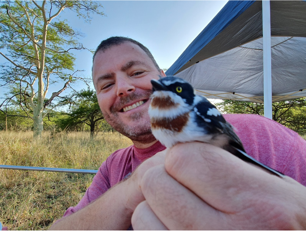 James holding a female Chinspot Batis (Batis molitor).