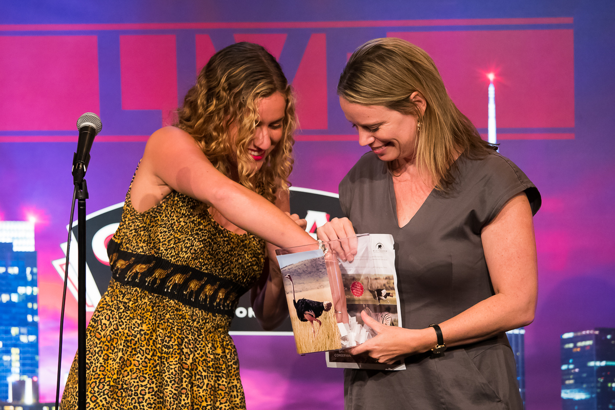 Tori and Wendy, from Wild Tomorrow Fund NYC, drawing the ostrich-naming raffle. Photo by Charles Chessler
