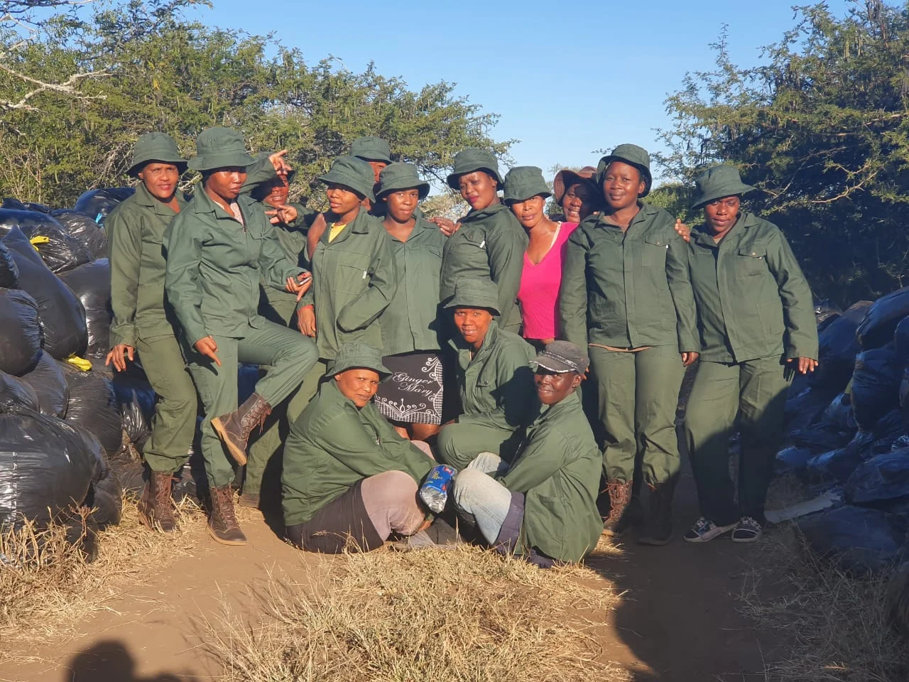 Team photo of the 14 Green Mambas, employed by Wild Tomorrow Fund for green and sustainable jobs.